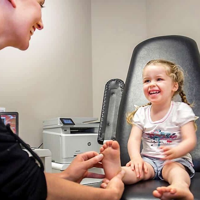 Kids Foot health-a podiatrist treating a child's feet